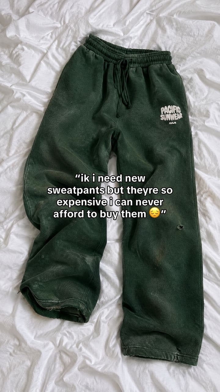 Slide 1: Worn-out green sweatpants on white sheets with a quoted complaint
